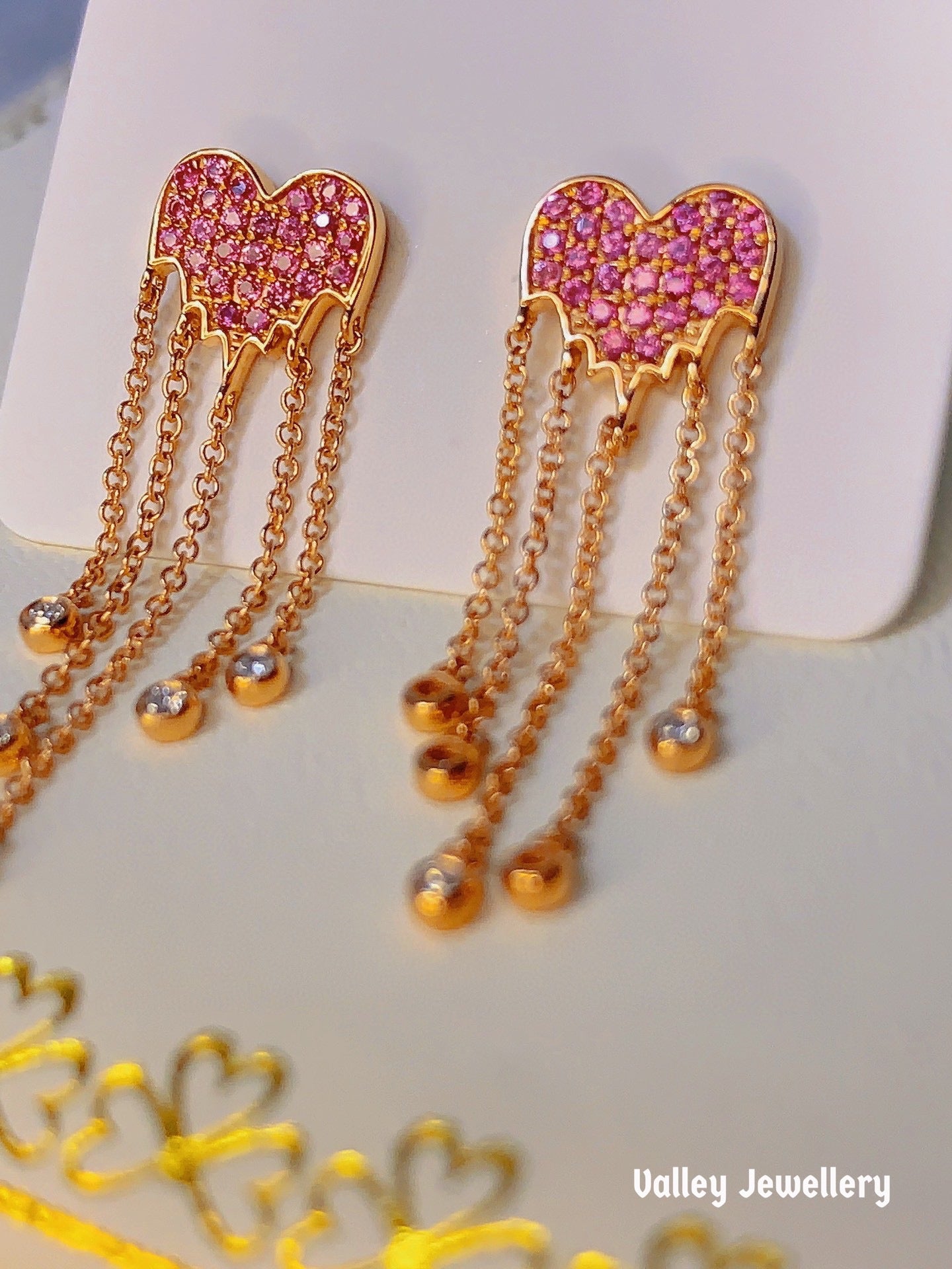 18k diamond with pink sapphire love earrings