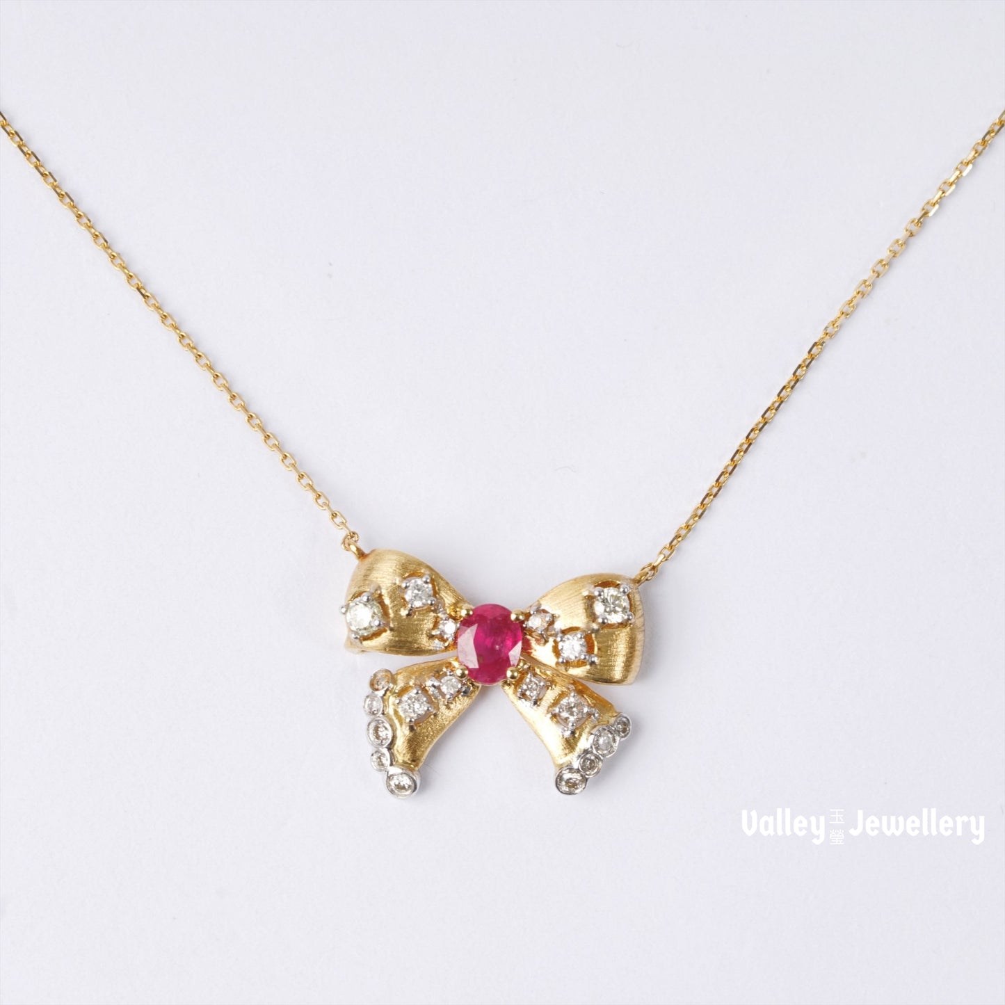 18K Yellow Gold Ruby Bowtie Pendant with Chain